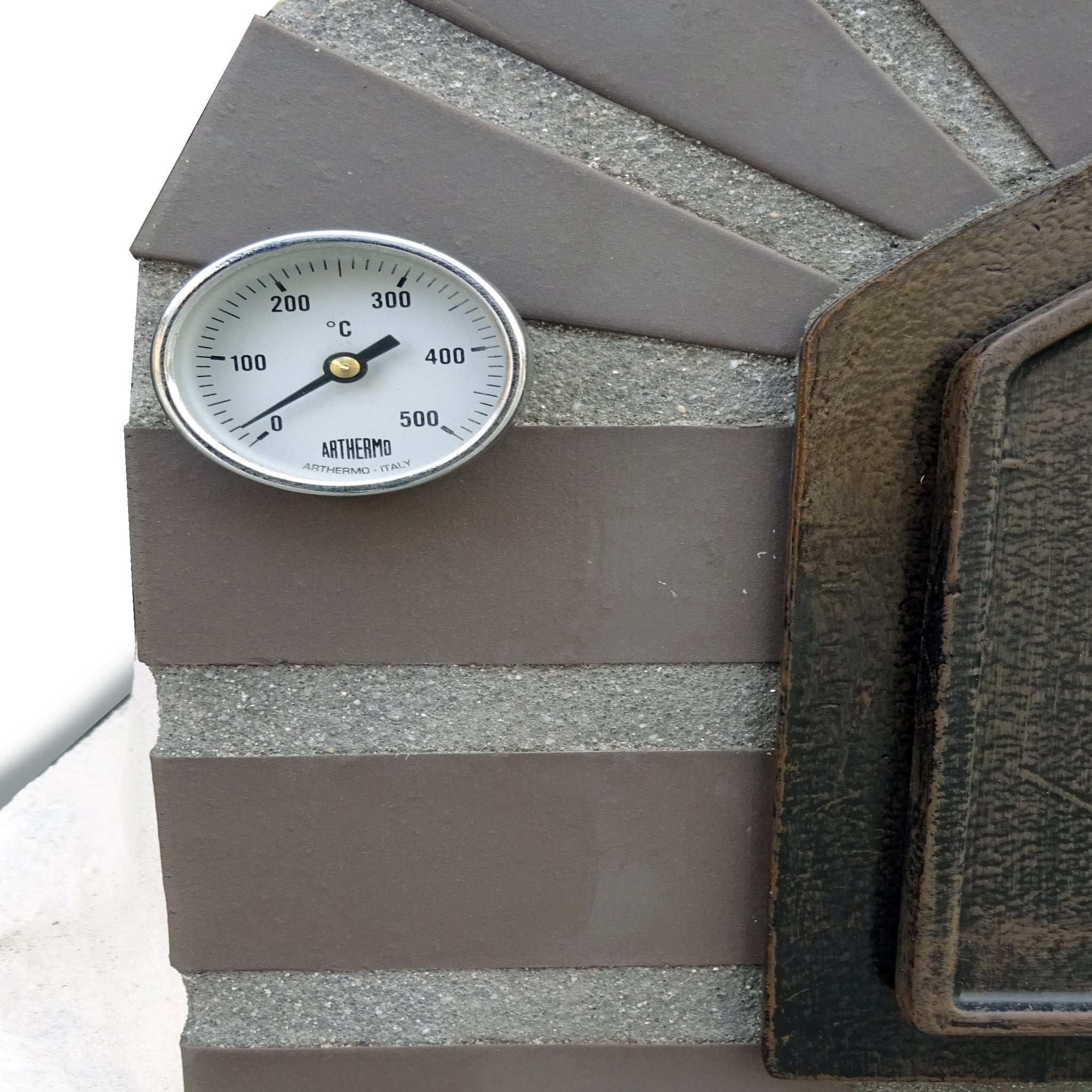 Thermometer on a brick wall with temperature markings