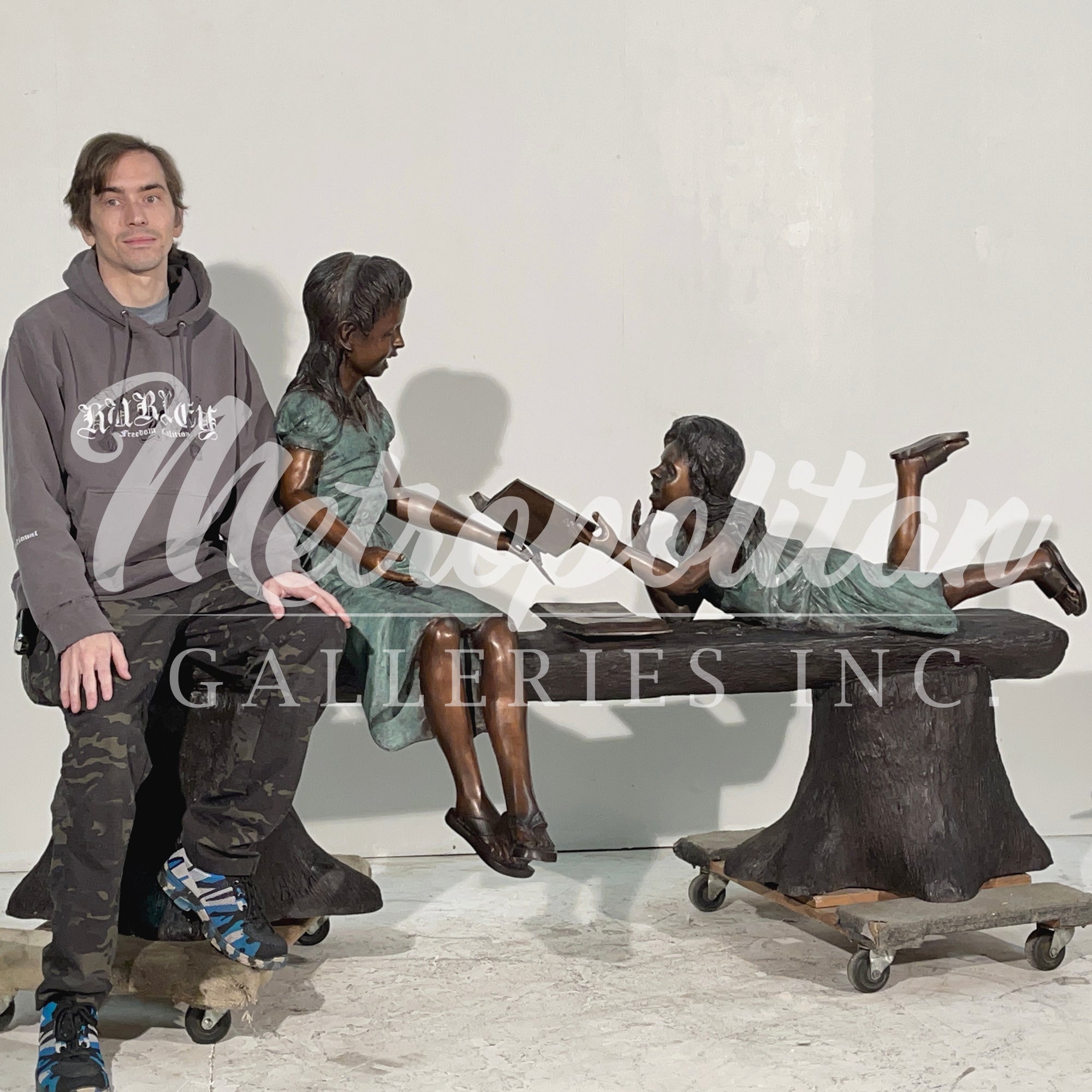 Two Girls Reading on Tree Trunk Bench Bronze Statue