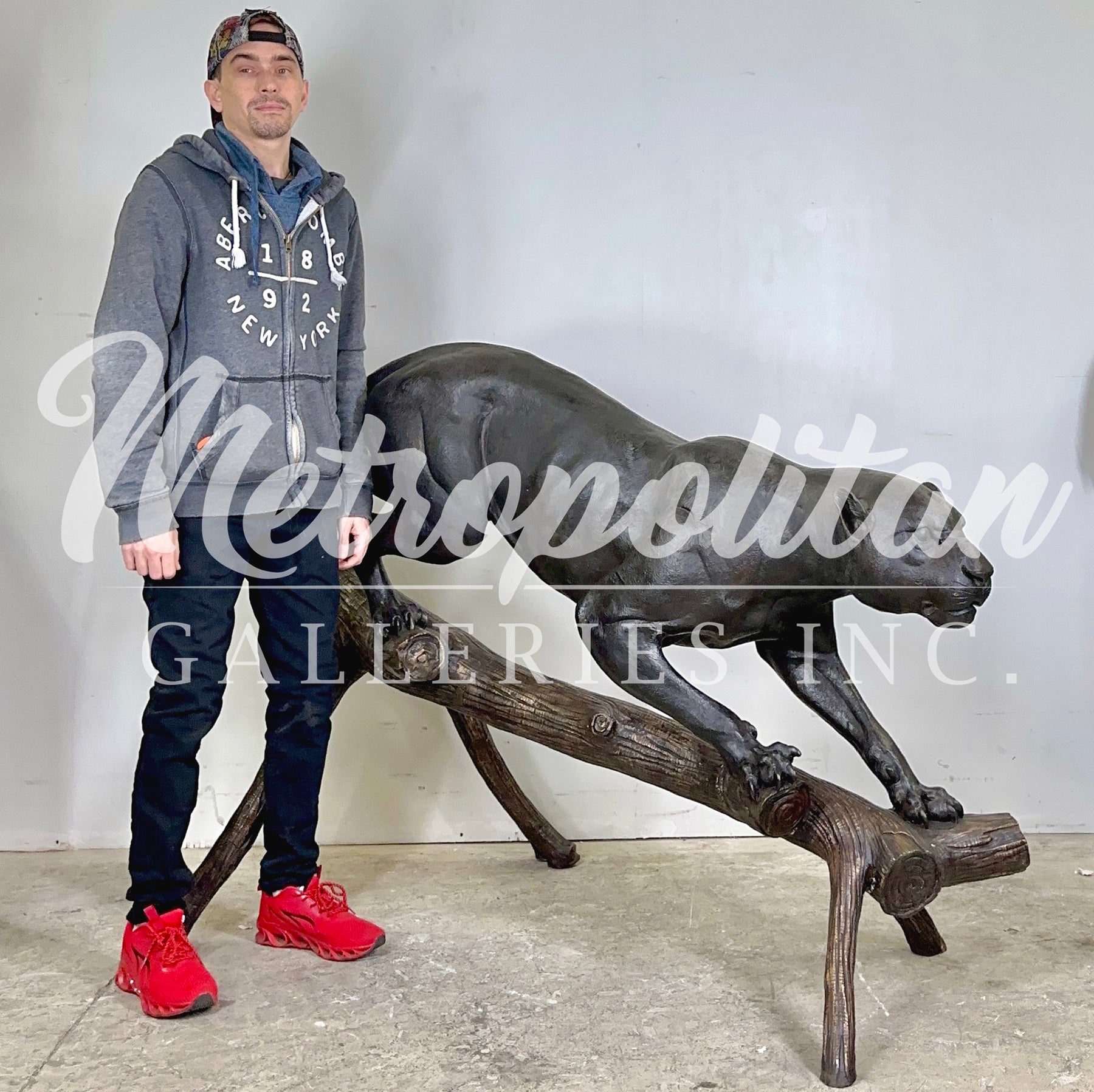 Life-Size Panther Walking Down Log Bronze Statue
